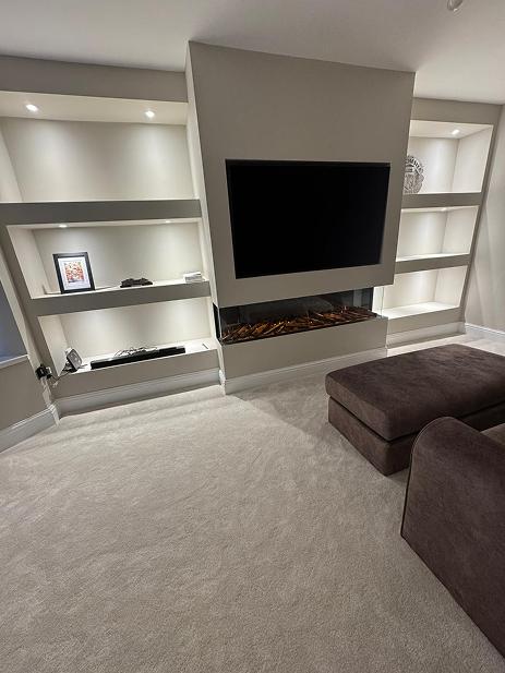 Built-in shelving with fireplace feature wall